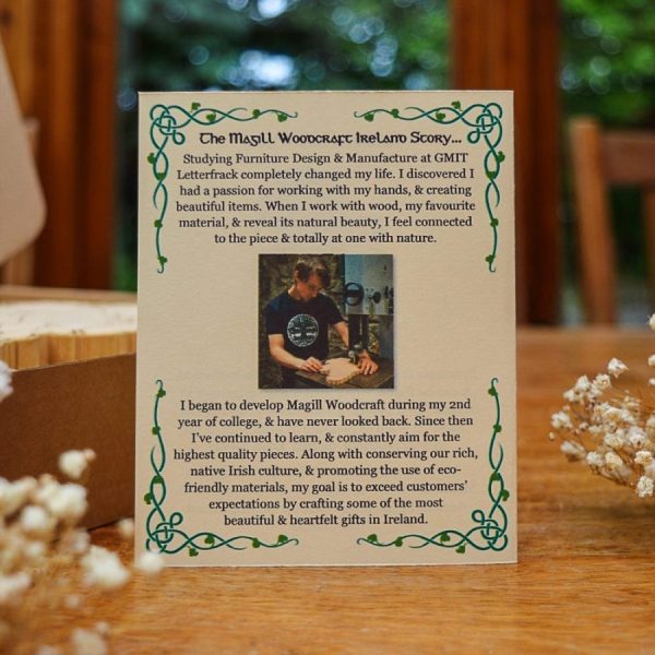 A Magill Woodcraft Ireland info card, printed with green Celtic leaf corners, a photo of Cian Magill, and the 'Magill Woodcraft Story'.