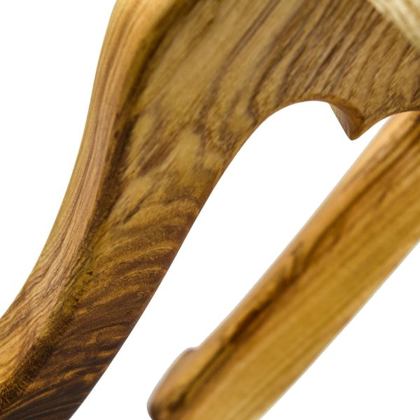 Leg close up of a handmade 3 legged wooden stool made from native Irish Ash wood on a white background. The seat is round and woodturned. The legs are in the Queen Ann style. The stool is about 12" tall x 10" in diameter.