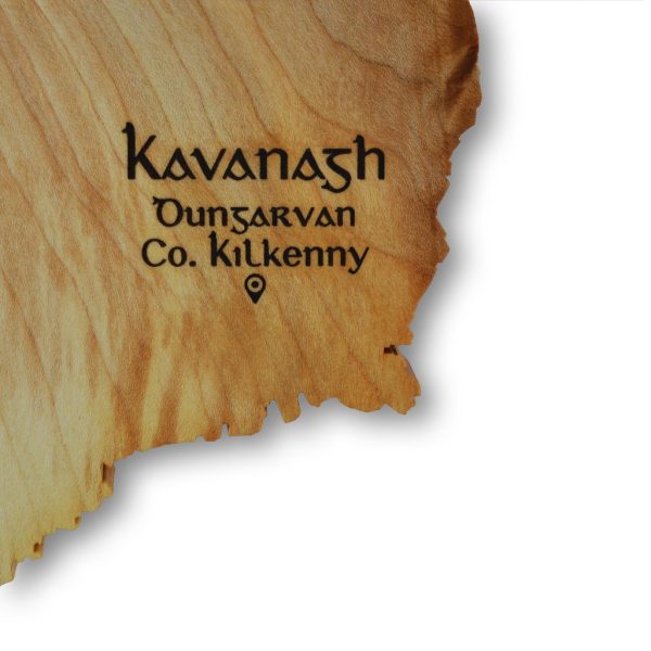 Close up of Irish surname engraved on a wooden map of Ireland wall decor piece.