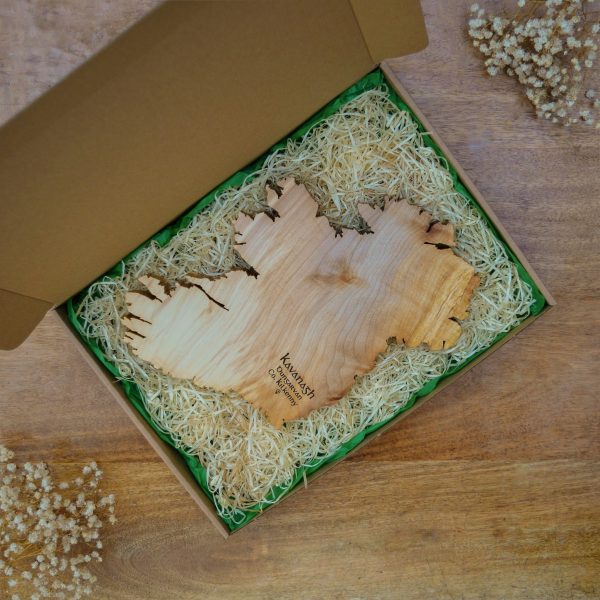 Engraved wooden map of Ireland in Magill Woodcraft Ireland cardboard gift box with wood wool and green tissue.