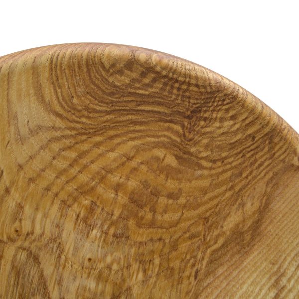 Top view close up of a handmade 3 legged wooden stool made from native Irish Ash wood on a white background. The seat is round and woodturned. The stool is about 12" tall x 10" in diameter.