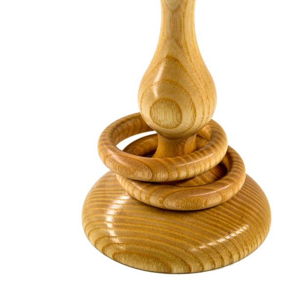 Two captive rings around stem of wooden Irish wedding goblet.