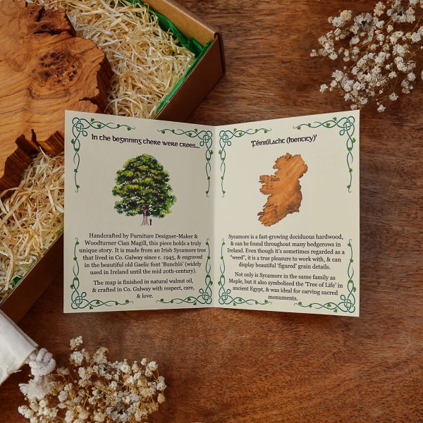 Celtic style info card for Magill Woodcraft wooden map of Ireland wall art on wooden table.